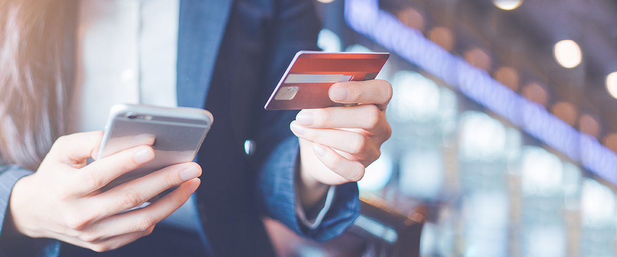 Business woman hand use credit cards and smartphones.